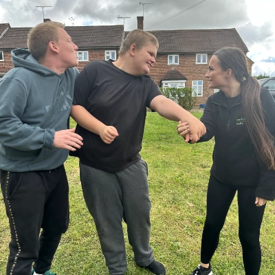 Two people caring for a child with special needs in the community.