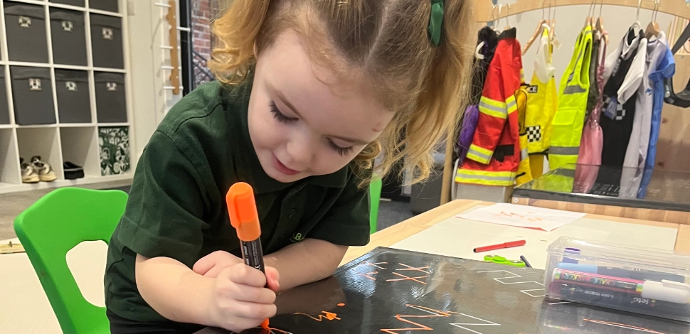 A child in nursery drawing.