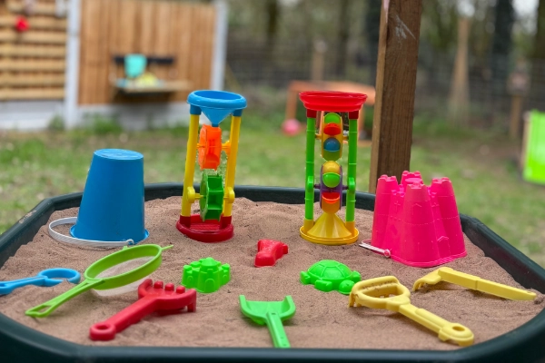 Sandpit and toys at nursery.