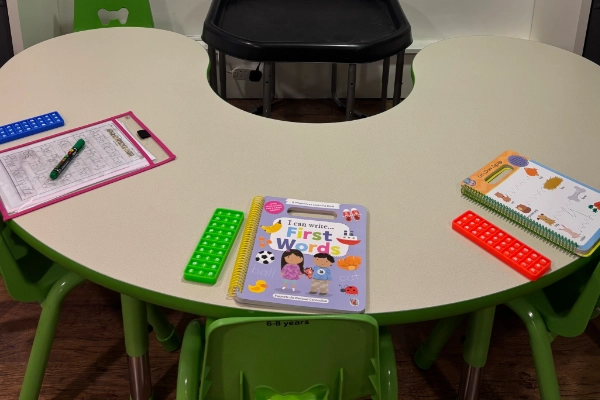 A school table with learning books.